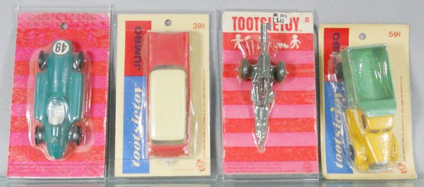 4 TOOTSIETOY CARDED VEHICLES: Lancia, Ford Station Wagon, Cannon, Mack Dump Truck, factory sealed on orig cards, cards have minor wear, C10.