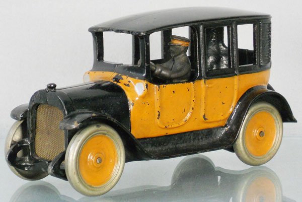 ARCADE YELLOW CAB: painted cast iron, some touch up to orange, 9" long, C6-7.