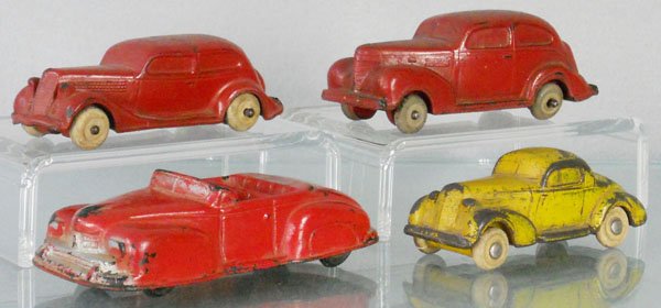 4 RUBBER AUTOS: Auburn 35 Ford, 4" long, 39 Plymouth, 4 1/2" long, 46 Lincoln, 4 1/2" long, w/square headlights, Rubbatoy 35 Oldsmobile, 3 3/4" long, some warping, C3-4.