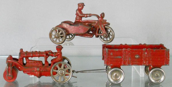 3 CAST IRON VEHICLES: Hubley Police Motorcycle, 4" long, Arcade Road Roller, 4" long, Arcade Trailer, 3 1/2" long, C5-6.