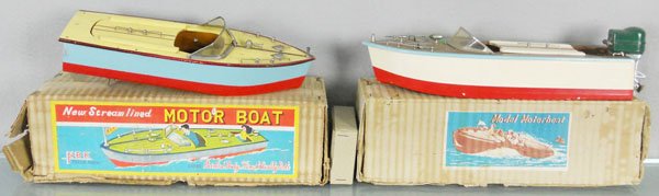 2 WOODEN MOTOR BOATS: 1 marked NBK, 10 1/2" long, other unmarked, 12" long, w/metal outboard motor, orig boxes worn & incom, C7-8.