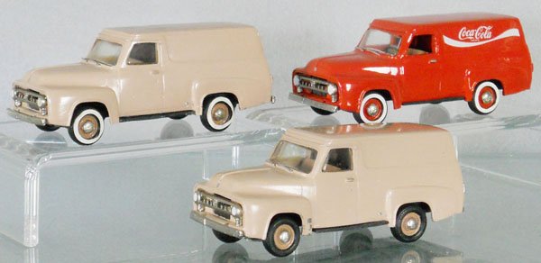3 AUTO BUFF FORD VANS: white metal, 1 tan van has a paint chip on fender, casting rough on 1 side, the 2 tan vans are C7, the Coca Cola van is C9.