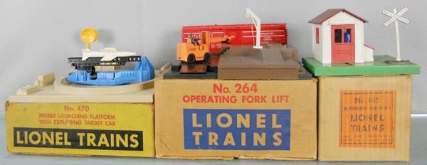 3 LIONEL ACCESSORIES: O ga, 470 missile launching platform, missile missing rubber tip, 264 operating fork lift, missing flat car & lumber, 145 automatic gateman, oxidation on base, orig boxes worn, C5.