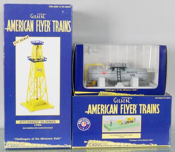 3 AMERICAN FLYER ACCESSORIES: S ga, 49846 Sunoco Oil derrick, 49851 Gilbert Oil storage tank, 49808 animated track gang, orig boxes, C10.