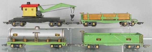 4 AMERICAN FLYER FREIGHT CARS: O ga, 410 tank, 406 log car, missing hold downs, 407 sand car, 416 wrecker, C5-6.