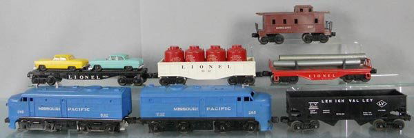 LIONEL TRAIN SET: O ga, 205 MP Alco AA, power A has cracked coupler support bar, 6424 auto car, 1 auto has a broken headlight, 6112 gondola w/containers, 6076 hopper, 6111 pipe car, 6017 caboose, C5-6.