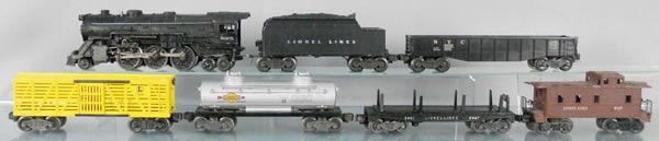 LIONEL TRAIN SET: O ga, 2035 loco, partially repainted, missing boiler decal, 6466W tender, 6462 gondola, 6656 stock car, 6465 tank car, 3461 log dump, 6017 caboose, C5-6.