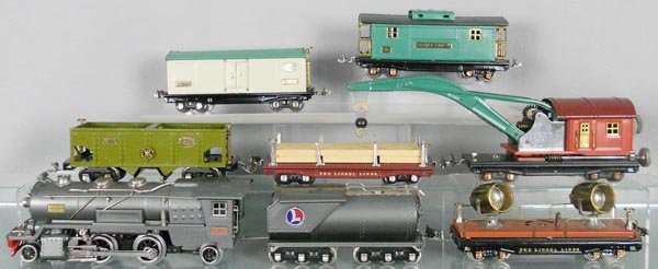 LIONEL TRAIN SET: O ga, 260E loco w/LTI frame & chugger, 260 tender, 820 searchlight, 816 hopper, 811 lumber flat, 810 crane, 814R reefer, 817 caboose, all are restored, C7-9.