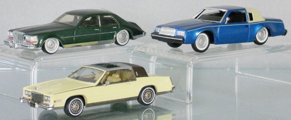 3 RESIN MODELS: Aurore Models 1980 Cadillac Seville, Swiss made by M. Schmid, rear window loose, Buick Coupe, blue, window piece loose inside, 1985 Cadillac Eldorado, C7-8.