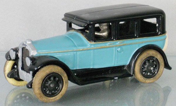 ARCADE BUICK SEDAN: painted cast iron, 8” long, front radiator insert cracked, restored, C7-8.