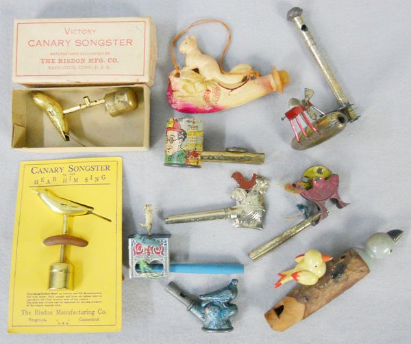 TOY WHISTLE LOT: 2 Canary Song Birds, from Risdon Manufacturers, Zeppelin, Grinder Wheel, Dancing Dog, Quail, Ed Wynn Siren, wooden Song Bird, celluloid Squirrel, all have wear from use, C4-8.