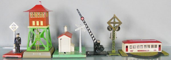 6 LIONEL ACCESSORIES: std ga, 1045 flagman, T-Reproductions 438 signal tower, 045 flagman, 077 crossing gate, 69 ringing signal, 442 diner, incom, base partially restored, C5-7.
