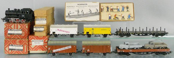 MARKLIN TRAIN SET: HO ga, CM800 tank loco w/cars 2 #306 box cars, 2 #306 box cars, 392C stake car, 391/2 flat w/trucks, 404G figure set, missing 1 figure, orig boxes minor wear, C5-7.