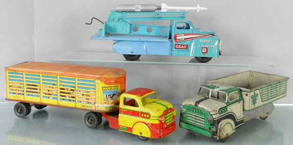 3 MARX TRUCKS: litho tin, Rocket Launching Truck, 13” long, incom, Livestock Truck, 17” long, tailgate intact, Tri-City Express Truck, 13” long, C4.