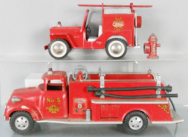 2 TONKA FIRE TRUCKS: painted pressed steel, 425 Jeep Pumper, 950 Suburban Pumper, missing 1 side door, both have some gray house paint drips on them, C5-6.