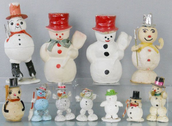 11 SNOWMAN DECORATIONS & CANDY BOXES: the tallest is 8” long, Snowman on Skates Candy Box, German, 2 pressed cardboard Candy Boxes, composition Snowman, 7 smaller composition Snowmen, C5-8.