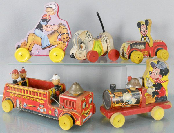 5 FISHER PRICE TOYS: litho paper & wood, 485 Mickey Choo Choo, 8 1/2” long, 7 Looky Fire Truck, 12” long, 310 Mickey Puddle Jumper, 6 1/2” long, Nosey Dog, missing ears, 6” long, w/reproduction Popeye, 7” long,