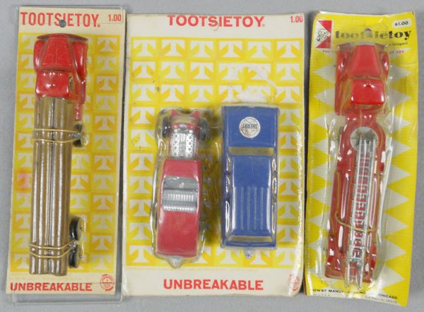 3 TOOTSIETOY CARDED SETS: Mack Log Truck, Sheriff & Hot Rod, Mack Hook & Ladder, factory sealed on orig cards, cards have minor wear, C10.