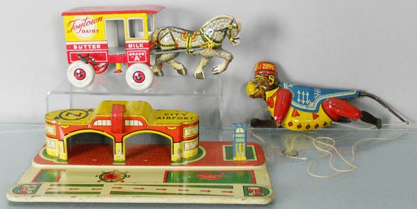 3 MARX TOYS: Toy Town Dairy, windup working, 10” long, City Airport, 12” long, Climbing Monkey, 10” tall, not working, C6-8.