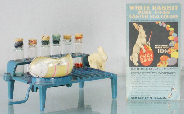 WHITE RABBIT EASTER EGG DYEING STATION: painted cast iron, 5 1/4" long, w/1 Dye Packet, station is stained w/dye, w/broken glass egg, C6-7.