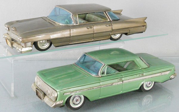 2 BANDAI AUTOS: litho tin, Cadillac Sedan, 11" long, oxidation spots on chassis, Chevrolet, 11" long, 1 crack in rear window, both are friction working, C5.