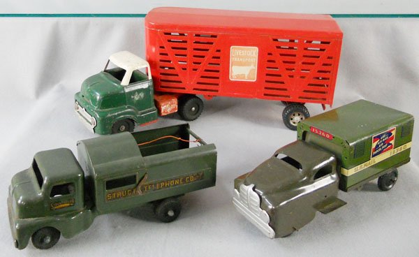 3 TOY TRUCKS: painted pressed steel, Dunwell Livestock Transport, 23" long, rear door intact, cab repainted, missing bumper & hub caps, Structo Telephone Truck, 12" long, decals worn, Banner Mail Truck, 11 1/2" lon