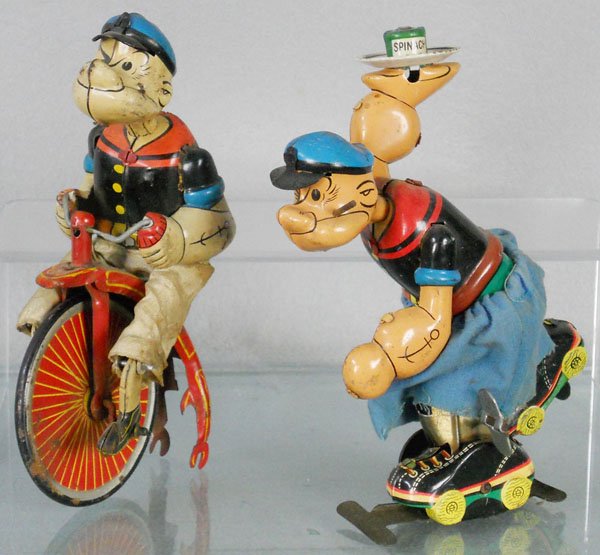 2 LINEMAR POPEYE TOYS: litho tin, Popeye on Bicycle, 6 1/2" tall, incom, some oxidation spots, Skating Popeye, pipe incom, 6 1/2" tall, windup working, C5.