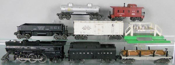 LIONEL TRAIN SET: O ga, 675 loco, w/Keystone nose decal chip, 6026W tender, 6411 log flat, 3469 dump car, 3472 milk car w/platform, 6465 Sunoco tank, chip in catwalk, 6357 caboose, C5-6.