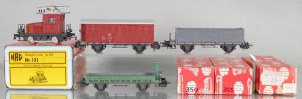 HAG FREIGHT TRAIN SET: HO ga, 2-rail, 131 TE101 loco, 300 box car, brown, 350 flat w/house, green, 325 hopper, gray, orig boxes, C9.