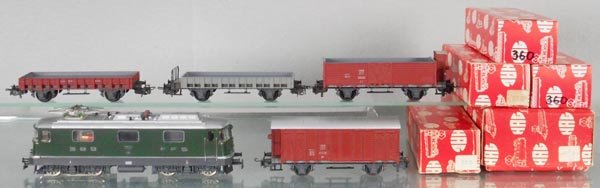 HAG FREIGHT TRAIN SET: HO ga, 3-rail, 160 electric loco, Re 4/4 II, 2nd version, 300 box car, brown, 320 hopper w/house, brown, some rust on frame sides, 2 #360 flat cars, 1 gray, 1 brown, orig boxes, 320 is C8-9, rest C9-1