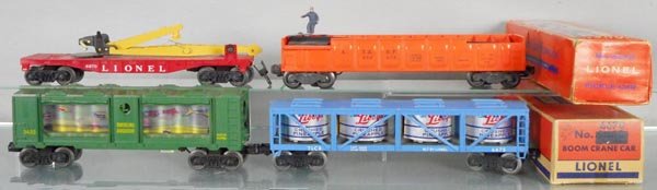 4 LIONEL FREIGHT CARS: O ga, 6670 boom crane car, 3562-75 barrel loading car, 3435 traveling aquarium, yellow letters, 6475 pickle car, 2 orig boxes only, boxes worn, C7-8.