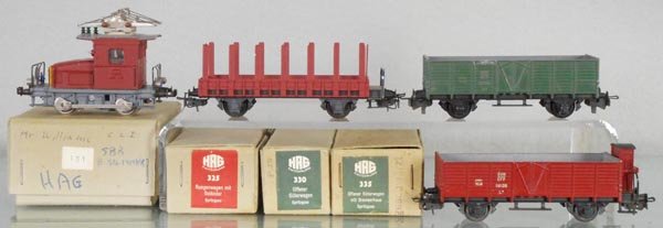 HAG TRAIN SET: HO ga, 2-rail, 131 Te101 loco, 335 hopper w/house, brown, 325 stake car, brown, 330 hopper, green, orig boxes, some w/graffiti, 1 stained, C8-9.