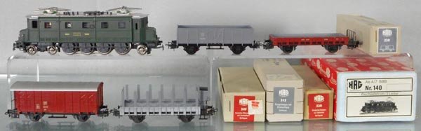 HAG FREIGHT SET: HO ga, 3-rail, 140 Swiss electric loco, Ae 4/7, 320 flat, brown, 315 stake car w/house, gray, 345 box car, brown, 330 hopper, gray, orig boxes, C9-10.
