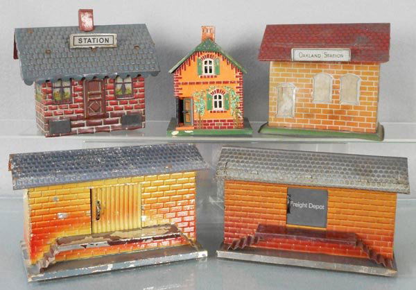 5 TRAIN STATIONS: O ga, litho tin, small Station, 6" long, missing base, Bing House, 5" tall, Chein Station, 5 1/2" long, 2 Fandor Freight Sheds, both 7 1/2" long, C4-5.