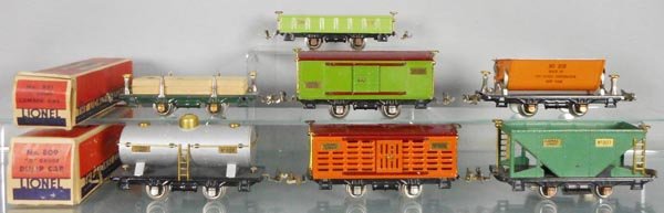7 LIONEL FREIGHT CARS: O ga, 902 gondola, 831 lumber flat, 805 box car, 809 dump, 804 tank, 806 stock, 803 hopper, 2 orig boxes only, boxes have some wear, C5-6.