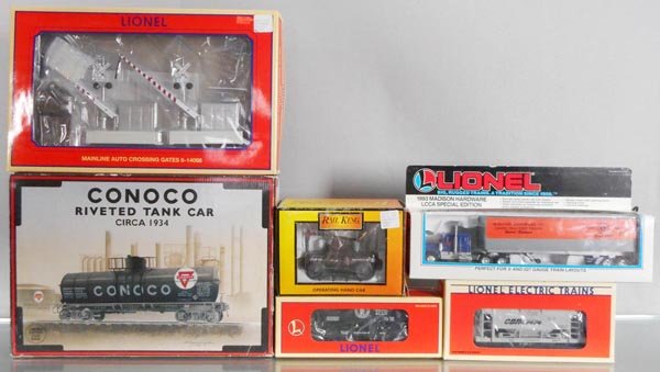 TRAIN LOT: O ga, K-Line K-639104 Conoco tanker, Lionel 14098 crossing gates, 52124 Ore car, 52071 ore car, 52025 tractor trailer, MTH Rail King PRR operating handcar, orig boxes & inserts minor wear, MTH box inc