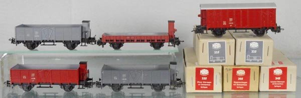 5 HAG FREIGHT CARS: HO ga, 305 flat w/house, brown, 345 box car, 2 #335 hoppers w/houses, gray, 335 hopper w/house, brown, orig boxes, some graffiti, C8-9.