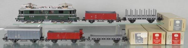 HAG FREIGHT TRAIN SET: HO ga, 3-rail, 120 Swiss loco, livery missing on 1 side, Ae 6/6, green, 340 box car, gray, 335 hopper w/house, brown, 325 stake flat, gray, 335 flat w/house, gray, 330 hopper, brown, 4 car orig boxes 