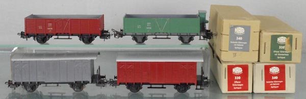 4 HAG FREIGHT CARS: HO ga, 340 box car, gray, 335 hopper w/house, green, 340 box car, brown, 330 hopper, brown, orig boxes, 1 w/graffiti, 340 is C7, rest C9.