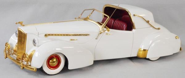 PACKARD DARRIN SEDANCA: plaster & wood, 26" long, brass trim, provenance unknown, C9.