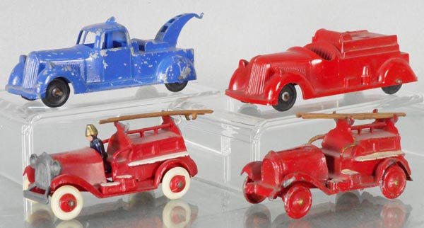 4 DIE CAST VEHICLES: Charbens Wrecker, Fire Truck w/ladder inside, 4 1/4" long, 2 Taylor & Barrett Fire Trucks, 3 1/4" long, 1 restored, C4-7.