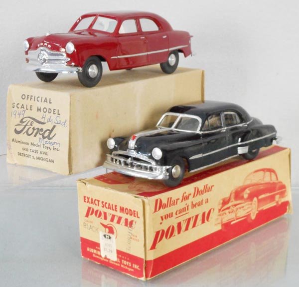 2 AMT PROMOS: 1949 Ford Custom, maroon, 1950 Pontiac, black, windup working, both have added silver embellishments, chassis repainted, orig boxes minor wear, C7-8.