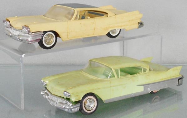 2 JOHAN PROMOS: 1960 Dodge Phoenix, yellow & blue, 1958 Cadillac Fleetwood, green, wheel hubs melting, both are friction, not working, bodies warped, C5.