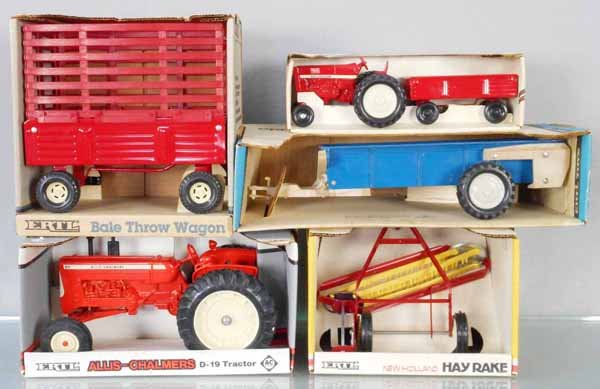 5 ERTL FARM VEHICLES: die cast, Bale Throw Wagon, 52 IH Tractor & Wagon, 822 Spreader, some staining on white trim, 2220 Allis-Chalmers Tractor, 316 New Holland Hay Rake, orig boxes & inserts, 2 worn, C7-9.