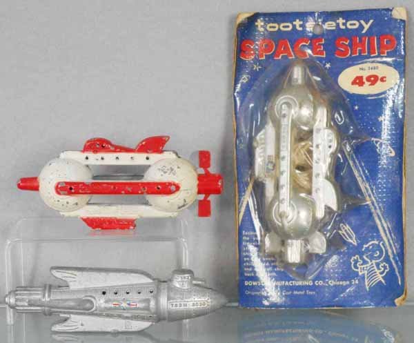 3 TOOTSIETOY BUCK ROGERS ROCKETS: 1033 Attack Ship, 1031 Battle Cruiser, decals worn, 2480 Space Ship, factory sealed on orig card, C5-10.