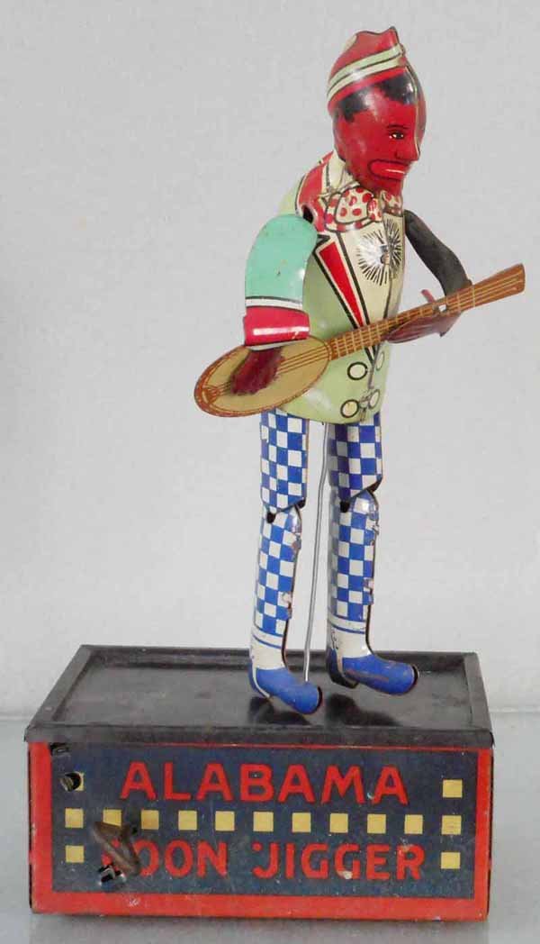 STRAUSS TOMBO, THE ALABAMA COON JIGGER: litho tin windup, working sluggishly, 10” tall, C7.