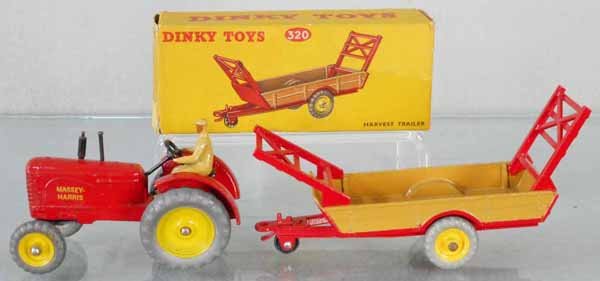 2 DINKY FARM VEHICLES: 300 Massey-Harris Tractor, minor paint chips on fender bottoms, 320 Harvest Trailer, orig box some wear, C7-8.