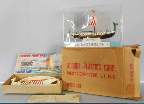 AURORA FAMOUS VIKING SHIP STORE DISPLAY & MODEL KIT: plastic display case containing built plastic Viking Ship model, case is 13” long, some curling on shield decals, w/orig shipping carton, 320 Viking Ship unbuilt model kit, appears complete, orig bo