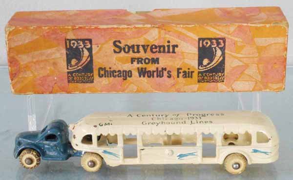 ARCADE CENTURY OF PROGRESS BUS: painted cast iron, 7 1/2” long, tires have minor wear, w/orig souvenir box from 1933 Chicago World’s Fair, orig box minor wear, C6-7.