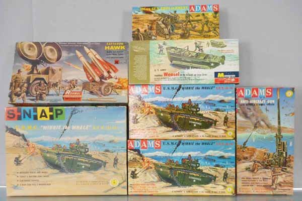 7 PLASTIC MILITARY MODEL KITS: Shap 157-149 USMC Winnie the Whale, Monogram PM24-98 US Army Weasel, Renwal M558-149 Raytheon Hawk, Adams K152-98 Gun Emplacement, K-156-129 AA Gun, 2 #K-157-149 Winnie the Whales, all unbuilt & appea